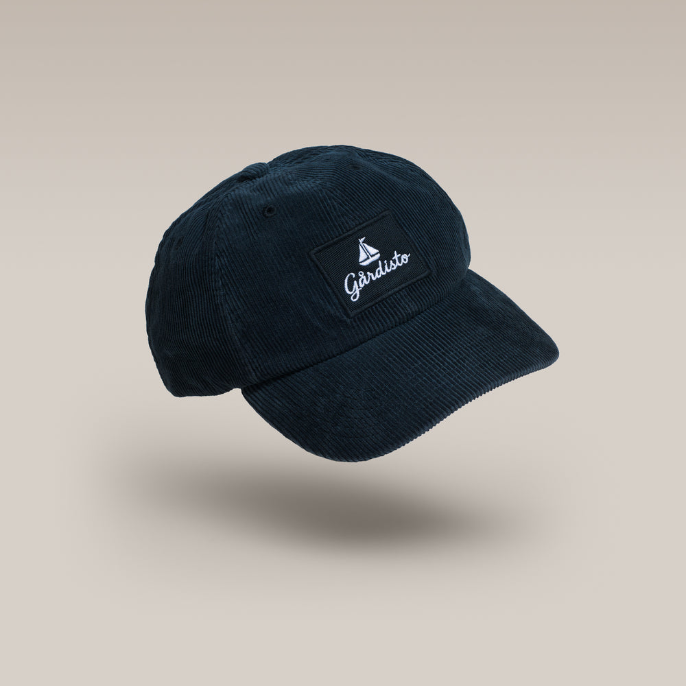 Navy Gårdisto organic cotton corduroy cap, front three-quarter view
